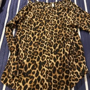 Woman’s Large animal print open shoulder shirt.